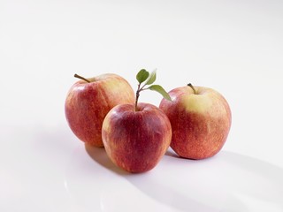Three red apples