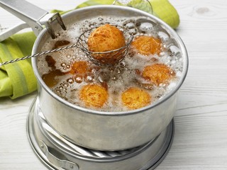 Cassava balls being fried