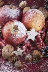 Apples and nuts with Christmas decoration