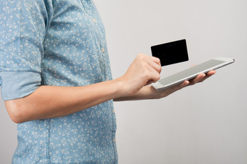 woman holding tablet pc and credit card indoor, Shopping Online