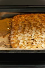 Butter cake on a baking tray in the oven