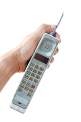man hand holding vintage mobile phone Isolated on white background.