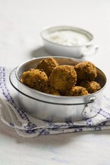 Rice and herb balls with a yogurt dip