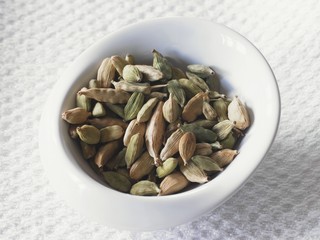 A bowl of cardamom pods
