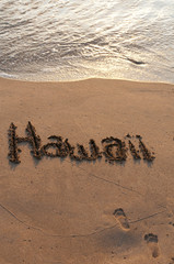 Hawaii written in the sand on Maui, Hawaii, USA