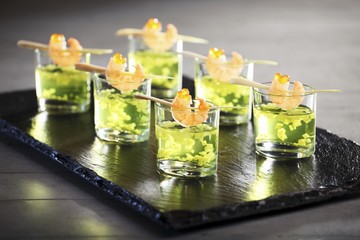 Vegetables and cucumber tonic with prawns on sticks