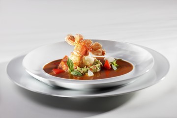 Fried crayfish tail with chorizo, avocado puree, pepper and crustacean bisque