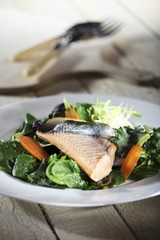 Char on a bed of spinach