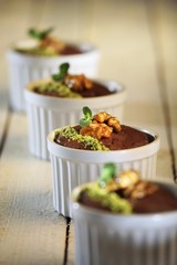 Mini chocolate cakes with walnuts and pistachios