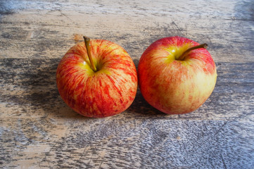 Red apple on wooden background