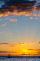 Beautiful sunset behind sport fishing boat on Maui, Hawaii, USA