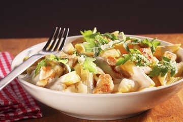 Penne Pasta, Chicken and Arugula in a Bowl