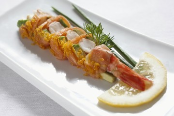 An appetiser of prawns, salmon and avocado