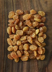 Raisins on a wooden surface