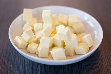 Fototapeta na wymiar Cubes of butter in a bowl