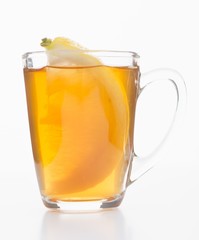 Black tea in a glass mug with a lemon wedge