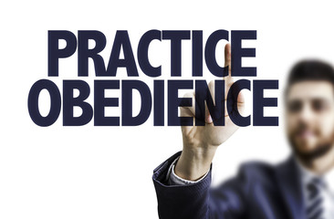 Business man pointing the text: Practice Obedience