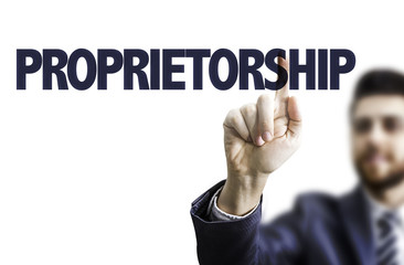 Business man pointing the text: Proprietorship