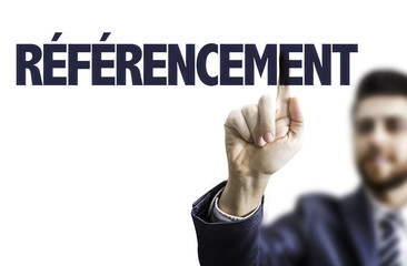 Business man pointing the text: SEO (in French)