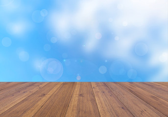 Abstract blue sky and beautiful bright bokeh background and wooden floor