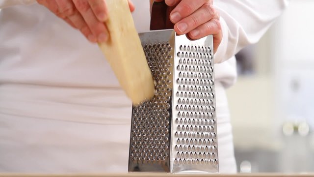 Parmesan cheese being grated