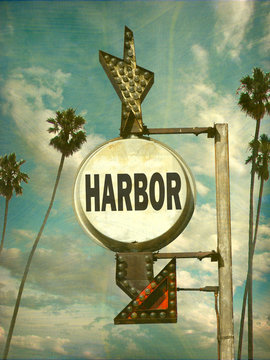 aged and worn vintage photo of harbor sign