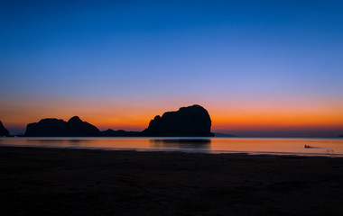 sunset on the beach of andaman sea