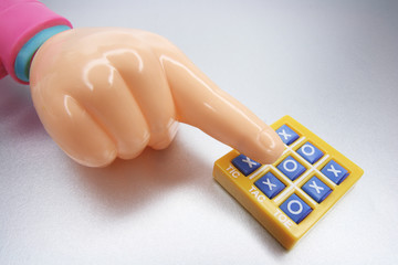 Plastic Hand  and Tic Tac Toe Game
