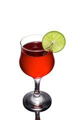 Red cocktail and lime on white background.