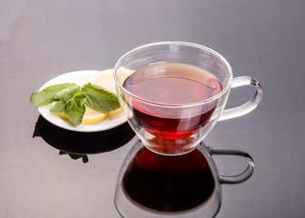 Cup of tea with cinnamon and mint