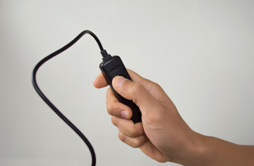 A man hand with a shutter release cable