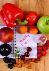 Fruits and vegetables with notebook, slimming and healthy food