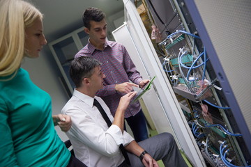 network engeneers working in network server room