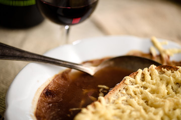Spoon in french onion soup