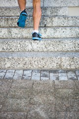 Athlete jogging up the stairs