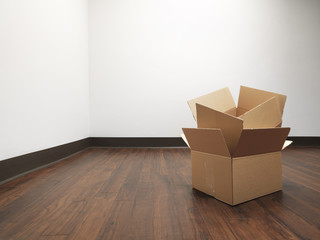 Boxes for house move empty room - Stock Image