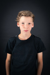 Handsome boy doing different expressions in different sets of clothes: thinking