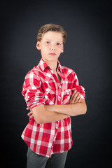 Handsome boy doing different expressions in different sets of clothes: arms crossed