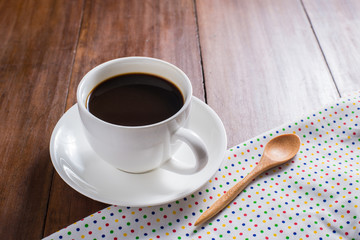 Coffee cup on wooden background