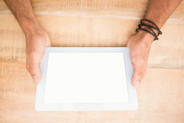 Obraz premium Hands holding blank screen tablet