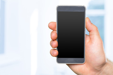 Man's hand holding smartphone