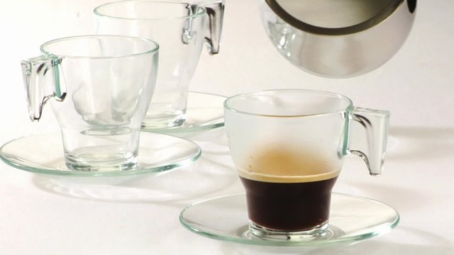 Pouring milk into coffee