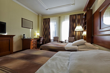 Interior of a hotel bedroom in the evening