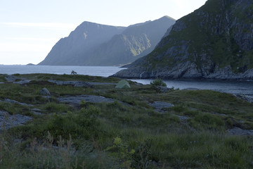 Fototapeta na wymiar A tent on a cliff formation in Lofoten, Norway
