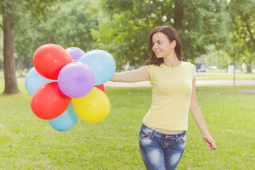 Happy Young Woman With Colorful Balloons