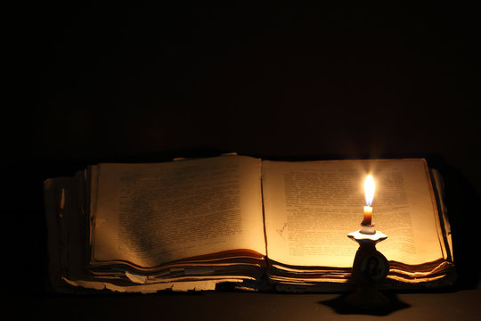 ancient book and candle