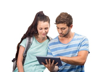 Composite image of students using tablet pc