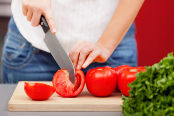 Young woman making salad