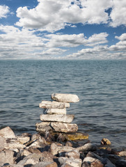 stones stacked on each other on the background of the ocean