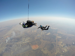 Fototapeta na wymiar Skydiver films tandem skydive